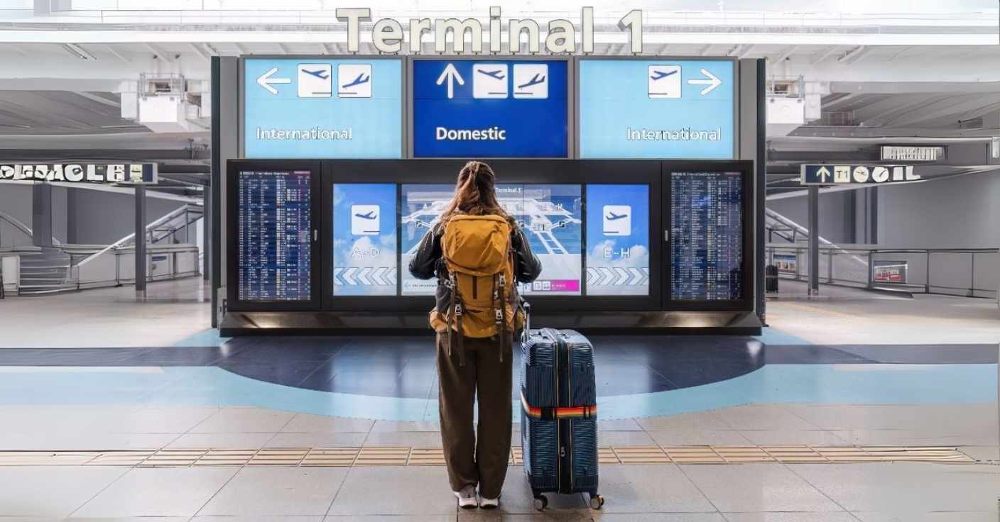 A Traveler Looking at Digital Signage for Navigation at Airport